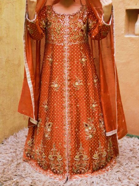 rust party wear maxi with matching dupatta draped on head showing front open silhouette